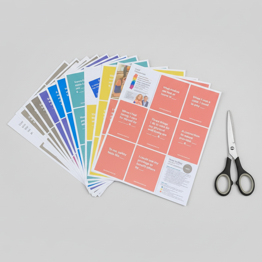 Colorful Cards for Belonging and Inclusion deck printed sheets with scissors on a white surface