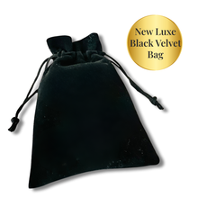 Load image into Gallery viewer, Black velvet drawstring bag with gold label on a white background. The Come Closer deck now comes with a luxurious black velvet drawstring bag. 