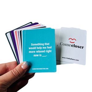 Come Closer Deck card game for couples. Something that would help me feel more relaxed right now. Turquoise card in hand.
