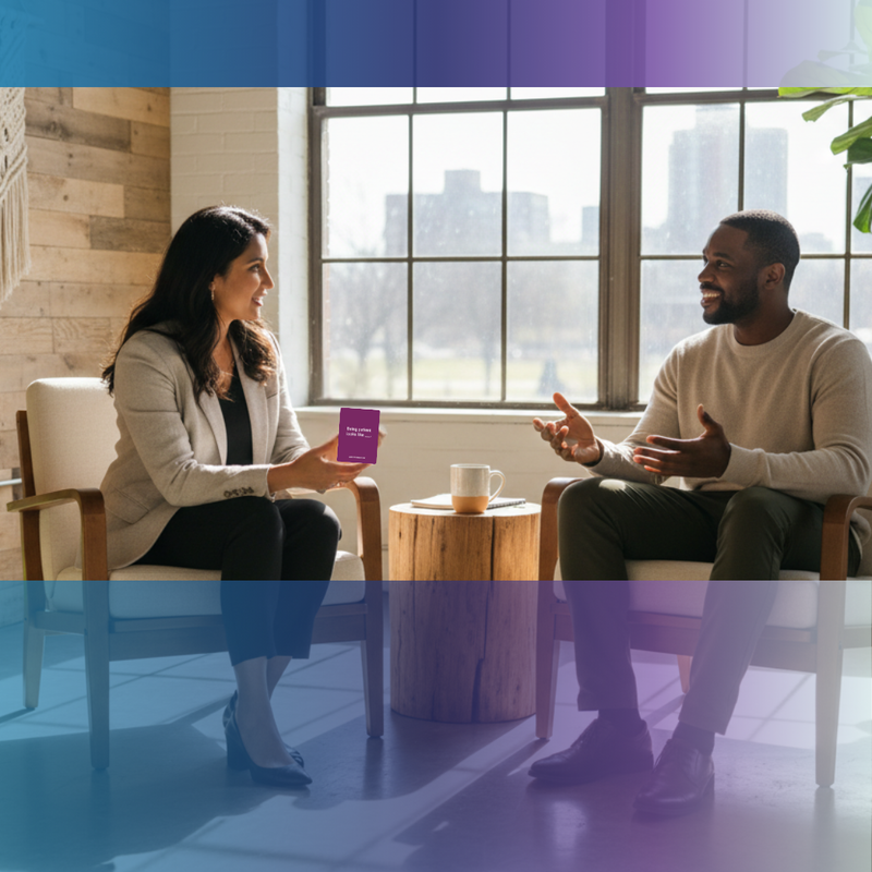 Two people sitting in a modern office setting with a cityscape view.