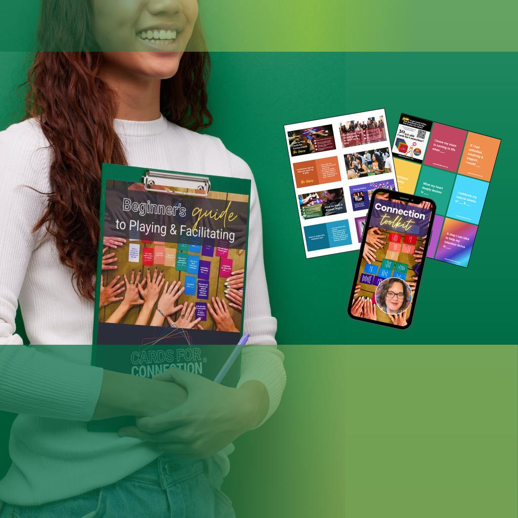 Facilitator holding connection cards and workshop materials, showcasing tools for leading meaningful group experiences.