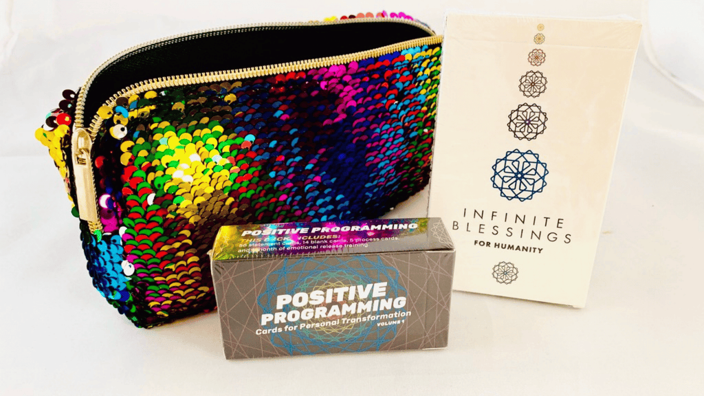 Sparkle Bag with Positive Programming and Infinite Blessings decks arranged in front.