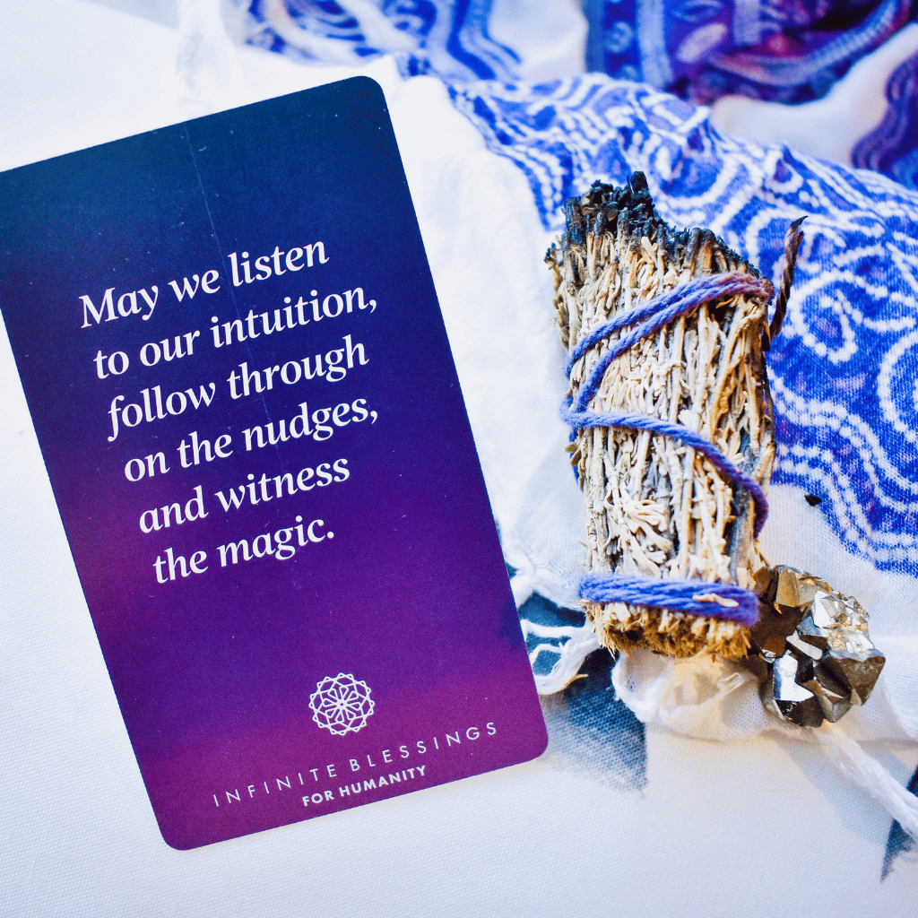 Purple Infinite Blessings card with sage bundle and fabric in a ritual setting.
